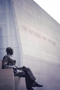 a person sitting in front of a building