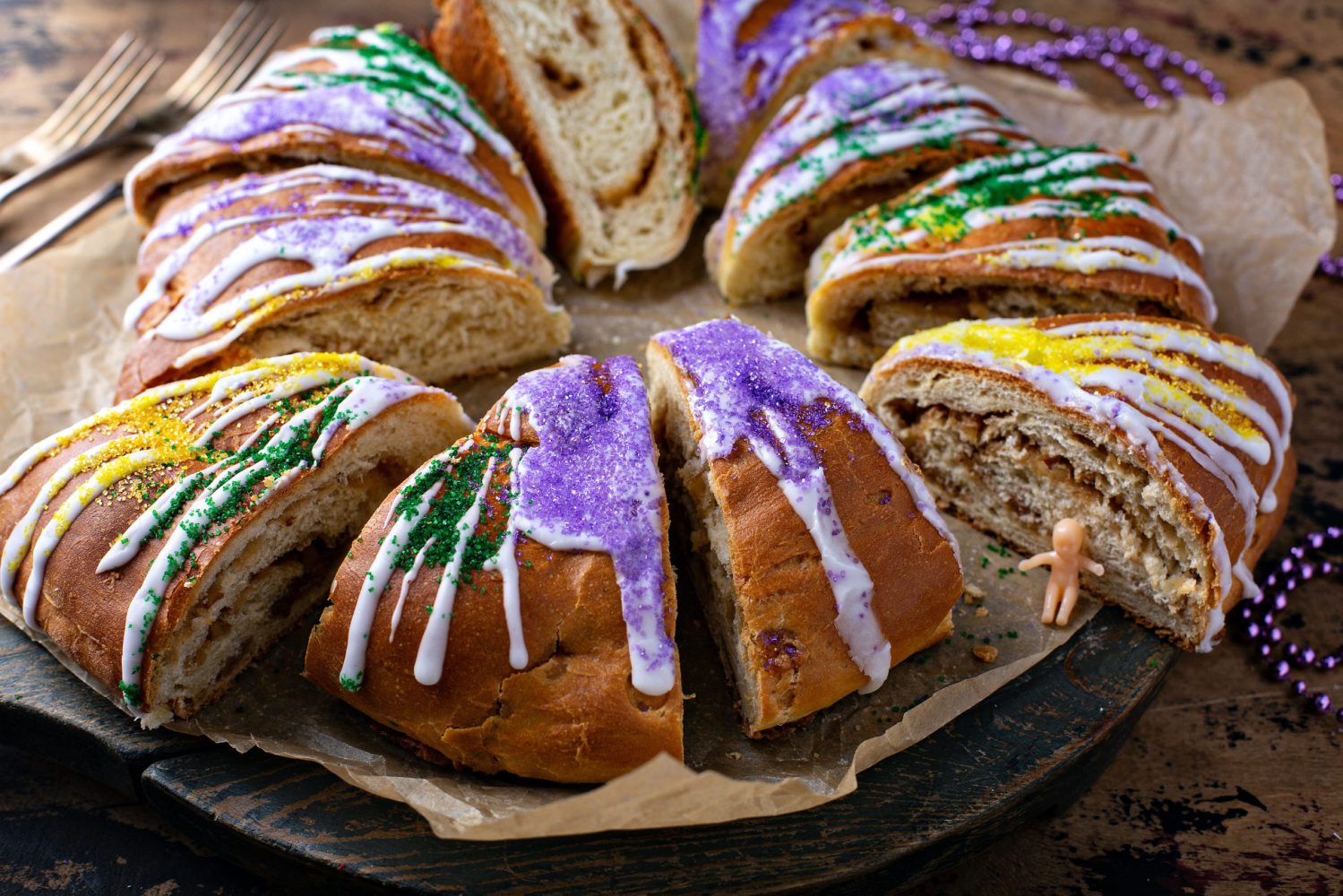 King cake for Mardi Gras, New Orlean traditional pastry with a plastic baby