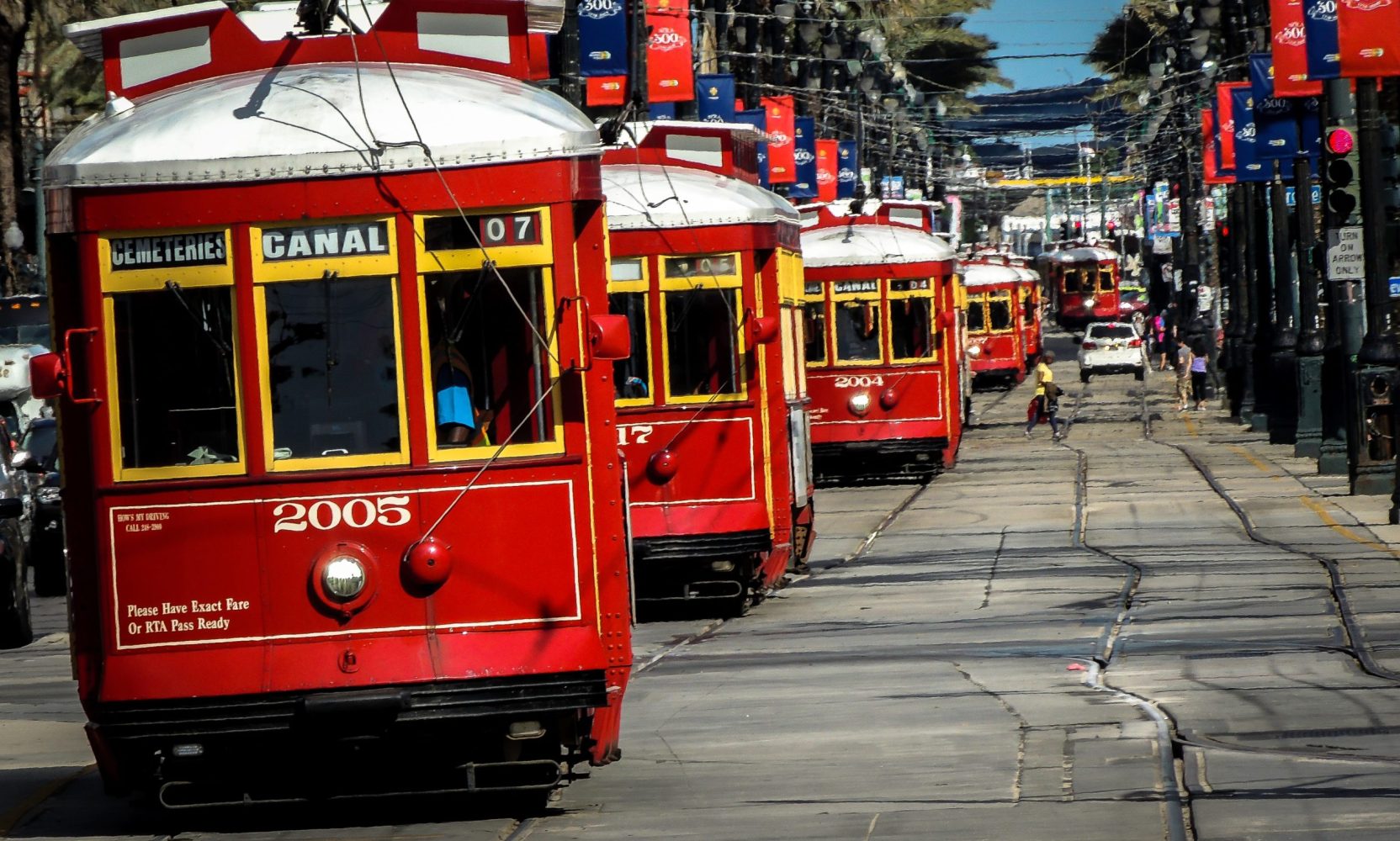 a double decker bus driving down a street