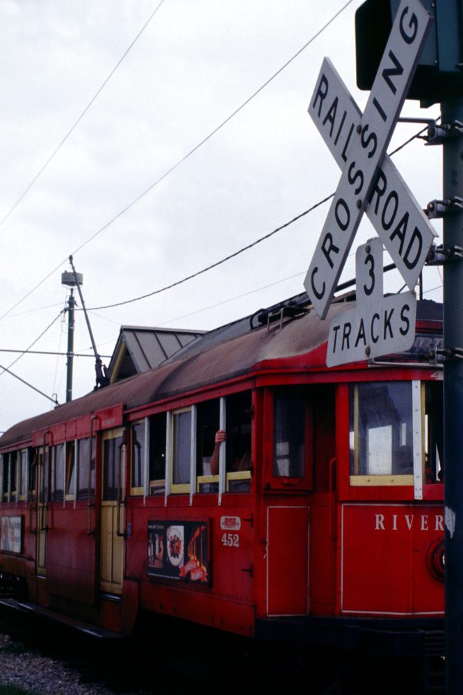 a train travels down the street